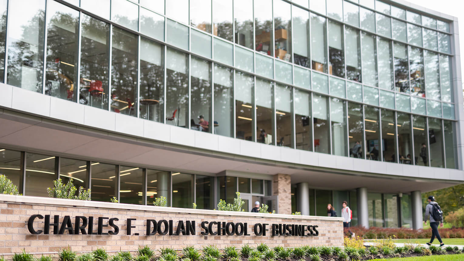 Exterior view of the Charles F. Dolan School of Business, featuring contemporary design and landscaped surroundings.  